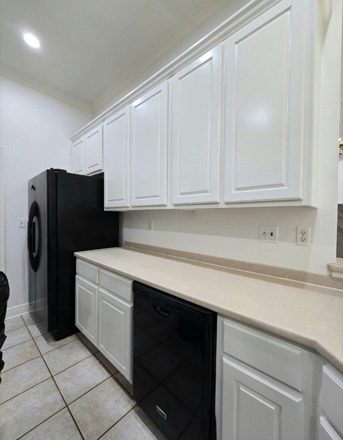 Cabinet painting — white kitchen full repaint by The Paint Guys, Lafayette LA