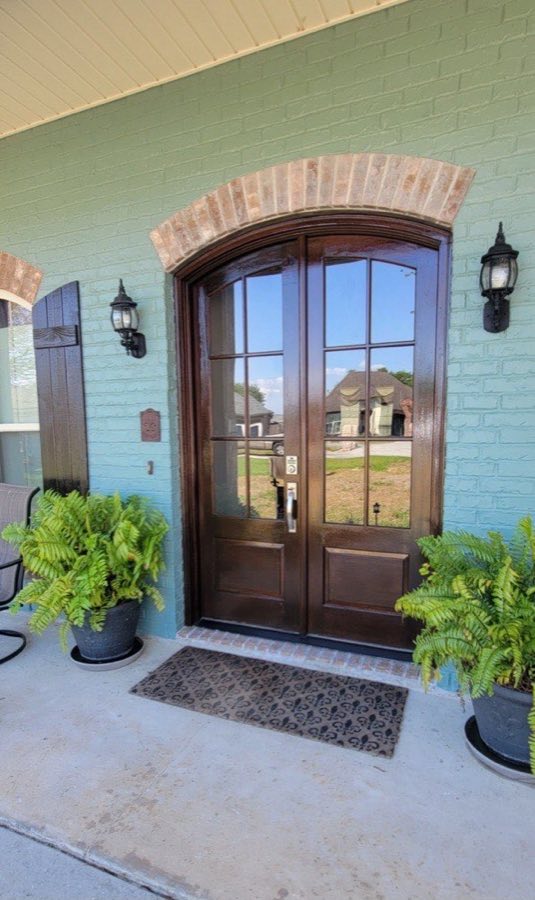 Exterior — brick arch and entry doors restored, The Paint Guys