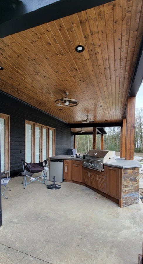 Tongue and groove ceiling installation on yellow porch, The Paint Guys